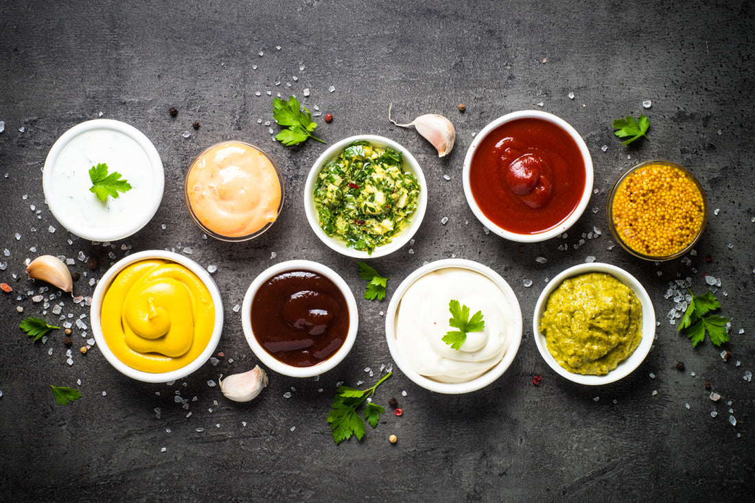 FUN Sesames Tahini Sauce | Miniature bowls showcase a variety of tantalizing tahini sauces, each offering a unique blend of flavors and textures to elevate your culinary creations with a creamy, nutty essence.