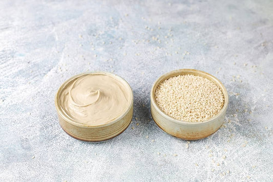 FUN Sesames Tahini Paste | Two bowls with sesame paste and seeds.